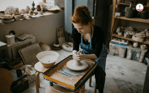 Young Women Entrepreneur Working in a pottery studio